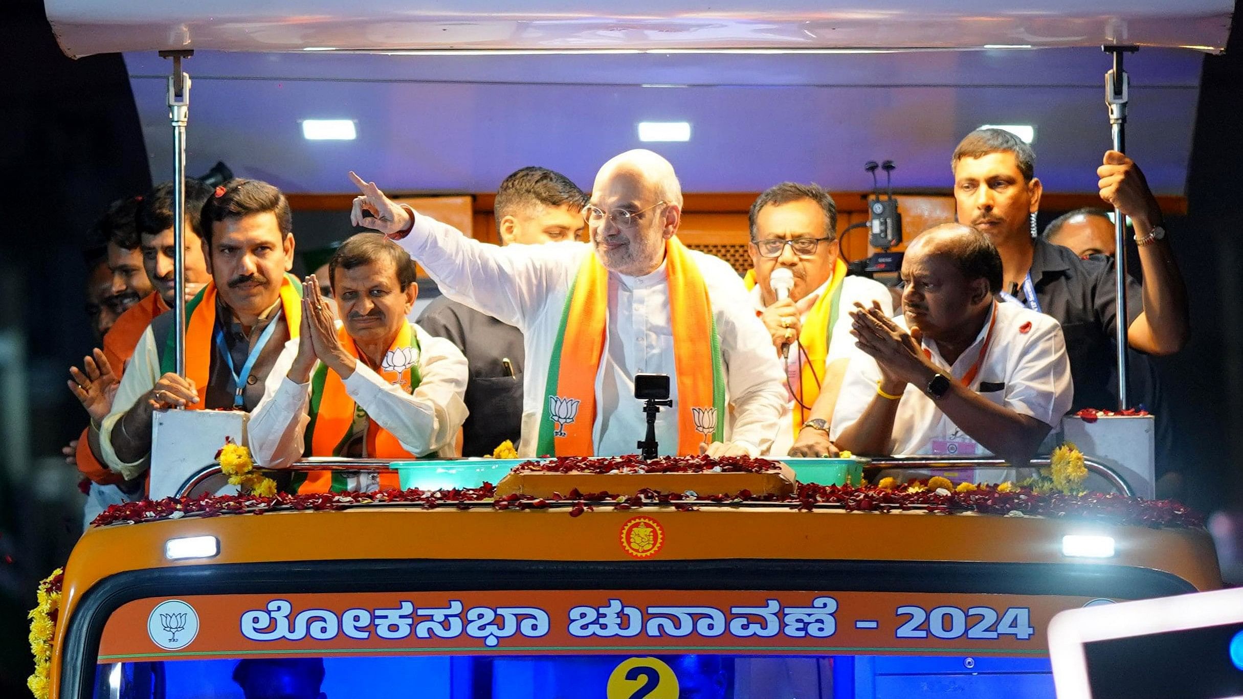 <div class="paragraphs"><p>Union Home Minister Amit Shah during the road show at Ramanagara district in Bengaluru on Tuesday.</p></div>