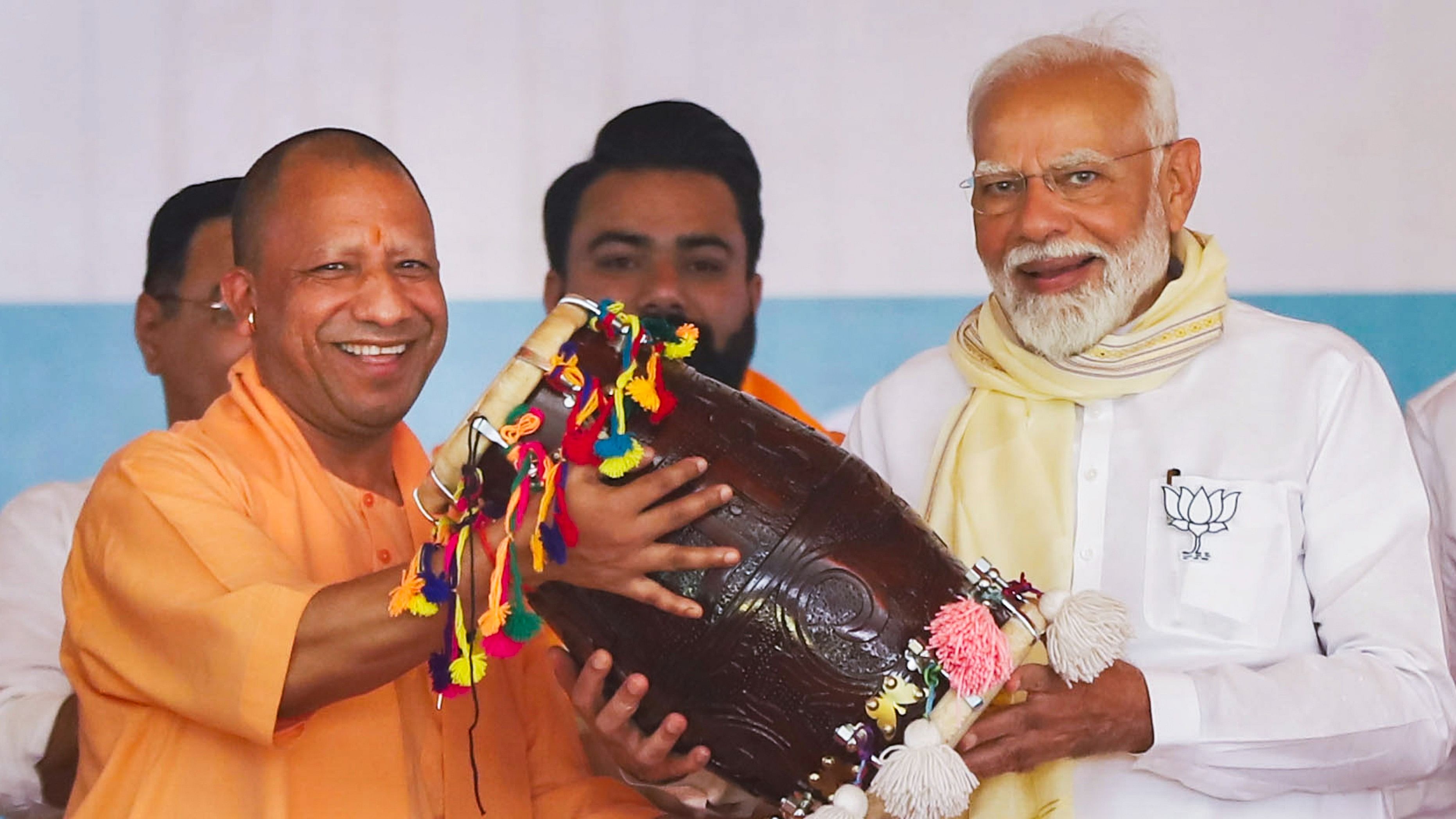 <div class="paragraphs"><p>PM Narendra Modi being felicitated by Uttar Pradesh Chief Minister Yogi Adityanath during a public meeting for the Lok Sabha elections, at Gajraula in Amroha, on Friday.</p></div>