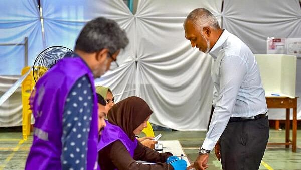 <div class="paragraphs"><p>Maldives President Mohamed Muizzu arrives to cast his ballot for parliamentary election at a polling station in Mali, Maldives.</p></div>