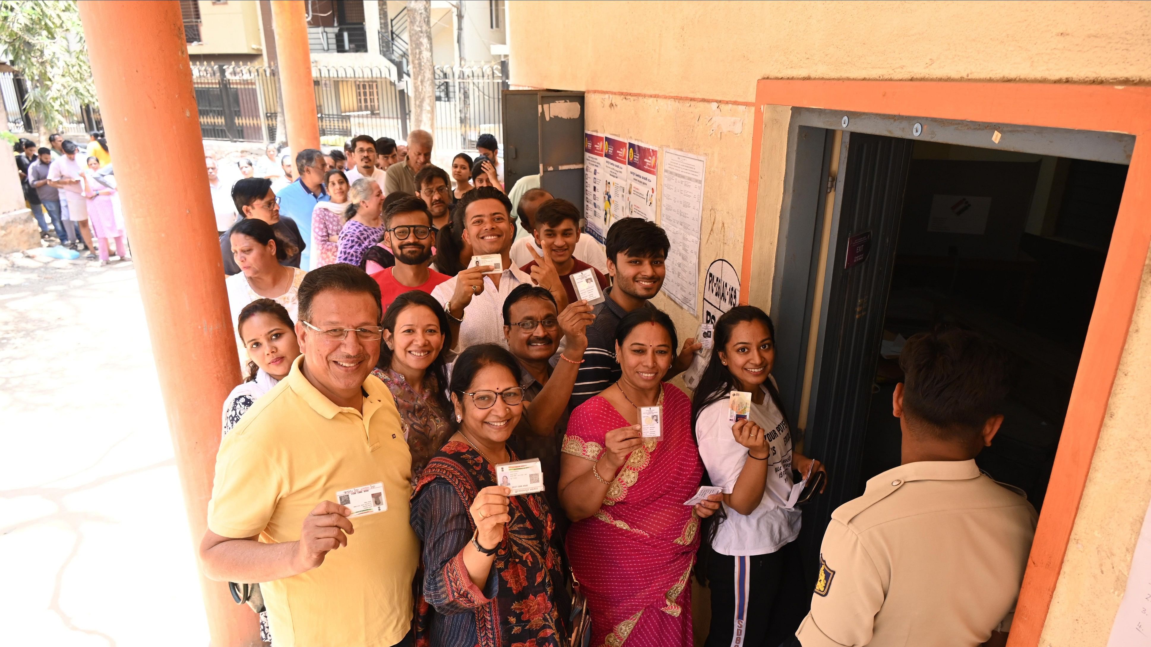 <div class="paragraphs"><p>Voters at a polling booth at the Government Girls Middle School in Gandhi Bazaar on Friday, during the second phase of Lok Sabha elections.&nbsp;</p></div>