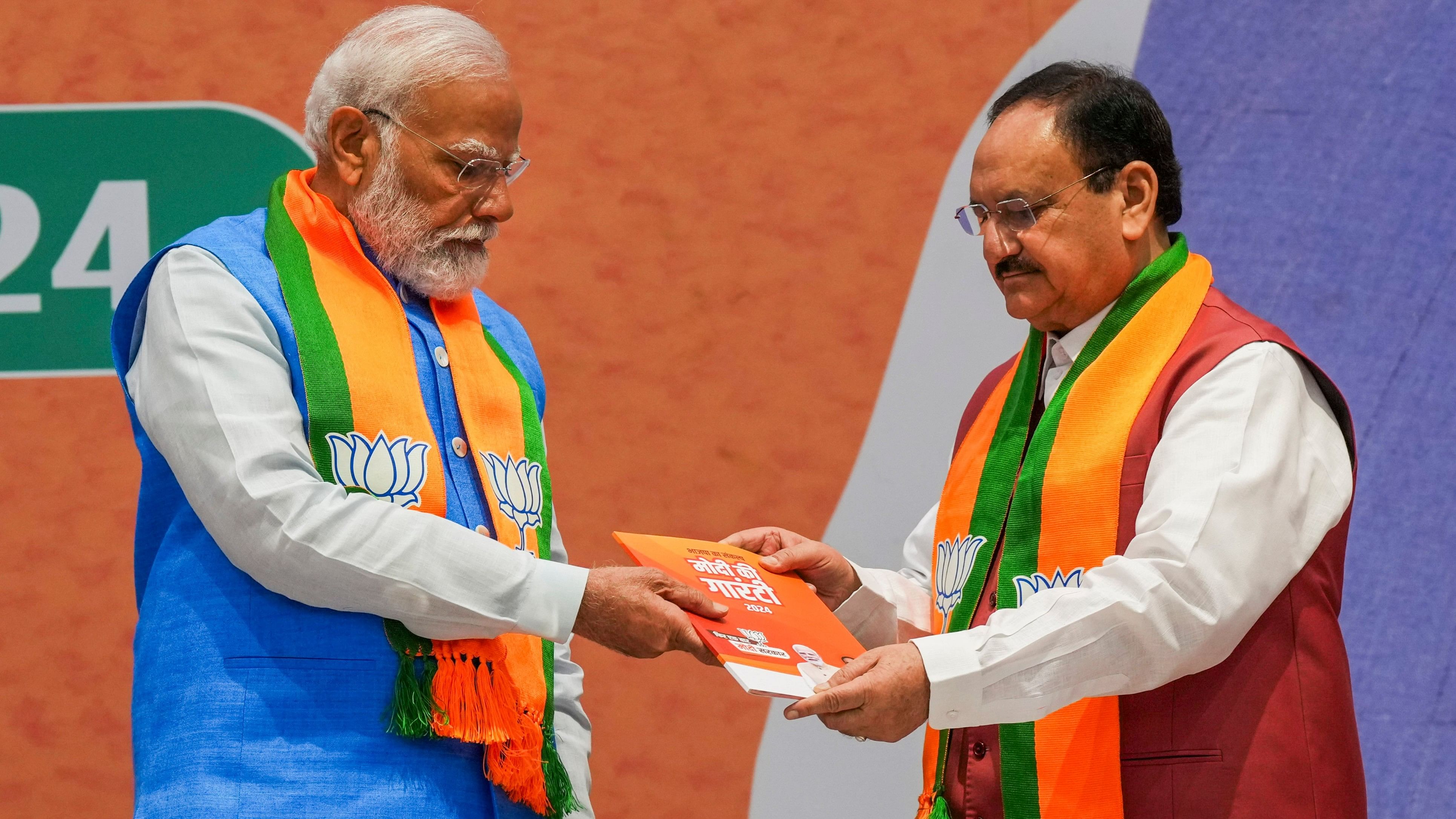 <div class="paragraphs"><p>New Delhi: Prime Minister Narendra Modi and BJP National President JP Nadda during the release of party's election manifesto 'Sankalp Patra' for the Lok Sabha polls, at the party headquarters, in New Delhi, Sunday, April 14, 2024. </p></div>