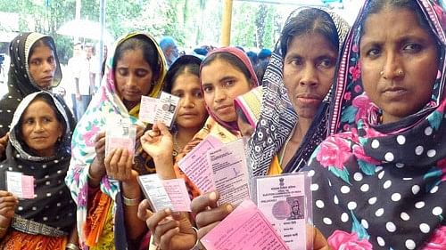 <div class="paragraphs"><p>This file photo shows erstwhile Bangladeshi enclave dwellers showing their ink marked fingers and voter cards after casting votes for the first time at a polling station.</p></div>