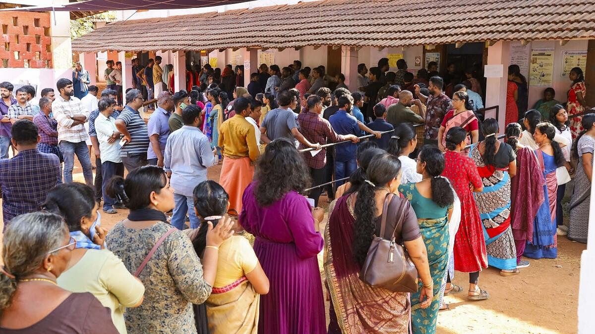 <div class="paragraphs"><p>Voters wait in a queue at a polling station to cast their votes for the second phase of Lok Sabha elections, in Kozhikode.</p></div>