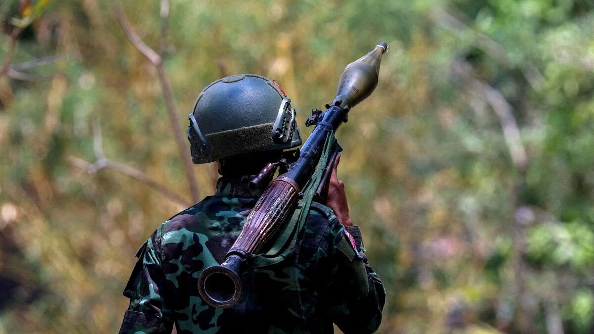 <div class="paragraphs"><p>A soldier from the Karen National Liberation Army (KNLA) carries an RPG launcher at a Myanmar military base at Thingyan Nyi Naung village on the outskirts of Myawaddy.</p></div>