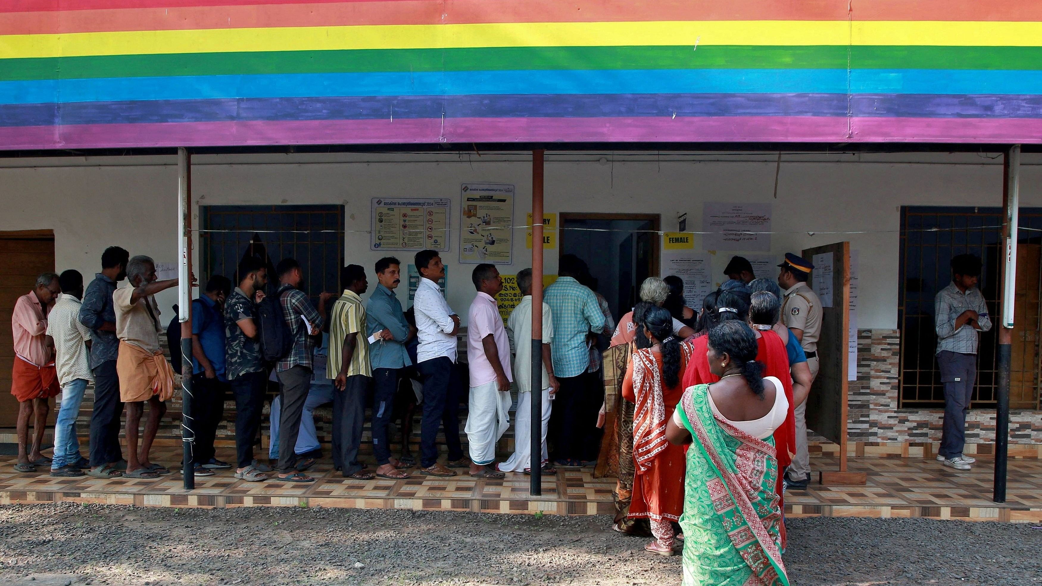 <div class="paragraphs"><p>People wait in lines to cast their votes at a polling station during the second phase of general election in Kerala.</p></div>