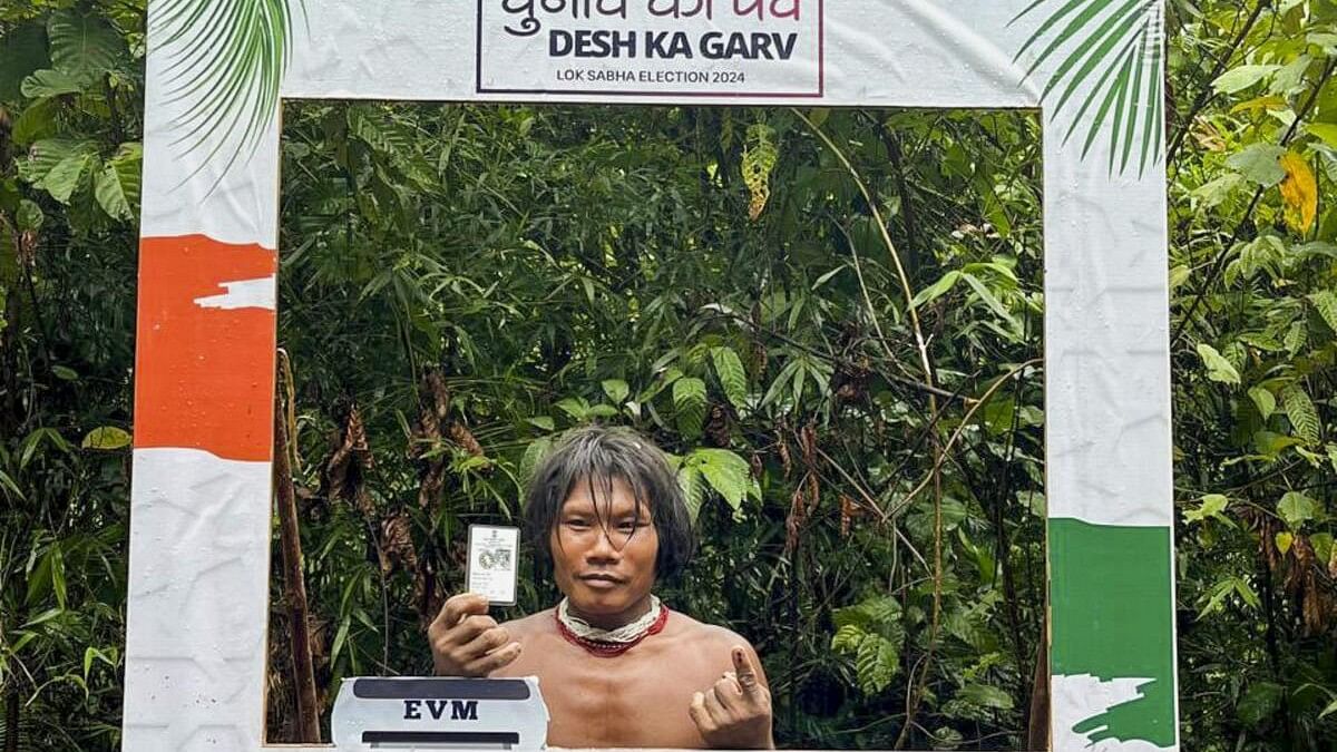 <div class="paragraphs"><p> A voter from the Shompen tribal community poses for a photo after casting his vote for the first phase of Lok Sabha elections in Andaman and Nicobar Island.</p></div>