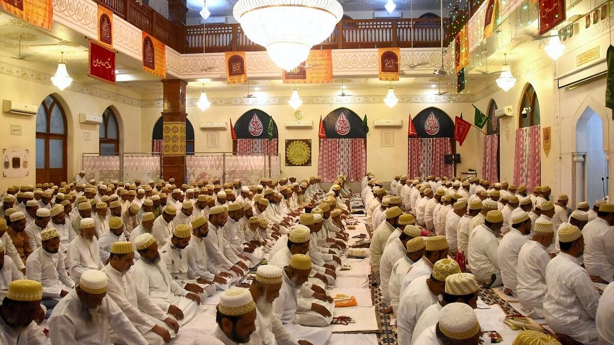 <div class="paragraphs"><p>Members of Dawoodi Bohra community offer prayers celebrating the 'Eid al-Fitr' festival, in Bhopal.&nbsp;</p></div>