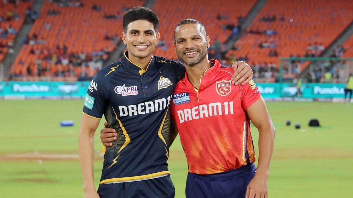 <div class="paragraphs"><p>Gujarat Titans skipper Shubman Gill (left) and his Punjab Kings counterpart Shikhar Dhawan strike a happy pose during the toss at Ahmedabad.</p></div>