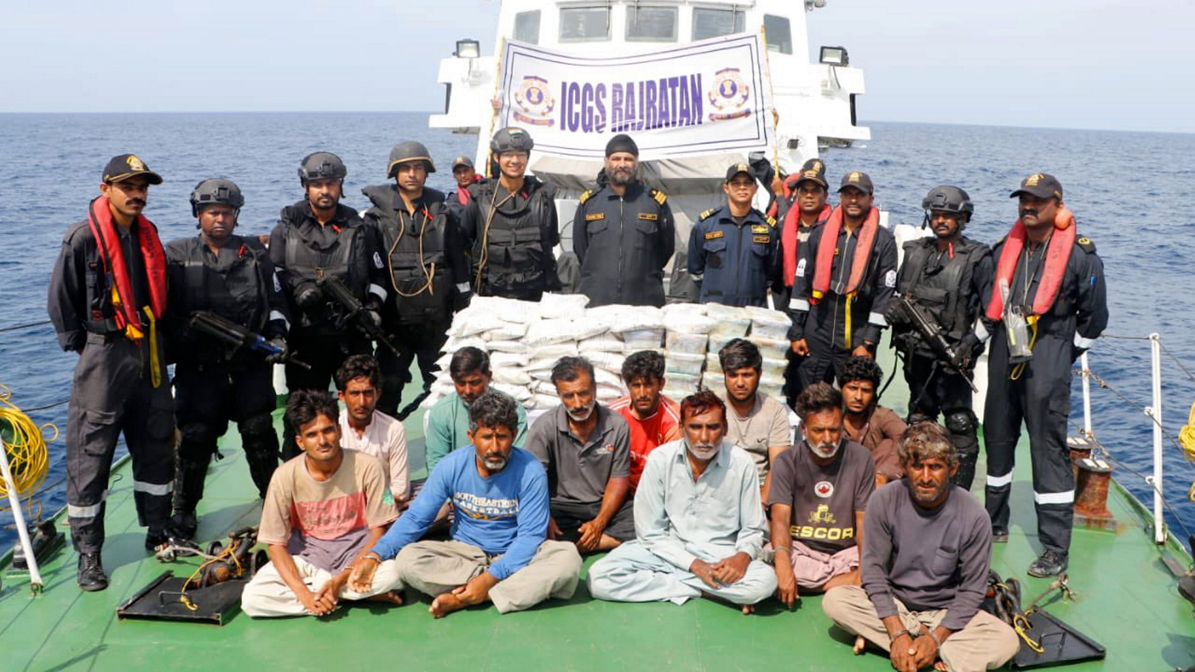 <div class="paragraphs"><p>Indian Coast Guard (ICG) personnel with 14 crew members of a Pakistani boat after apprehending them from Indian waters.</p></div>