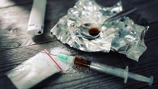 <div class="paragraphs"><p>Drug addiction syringe and cooked heroin on spoon; representative image.</p></div>