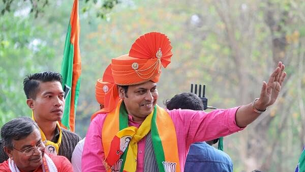 <div class="paragraphs"><p>Former Tripura CM and BJP candidate Biplab Kumar Deb campaigns for Lok Sabha elections.</p></div>