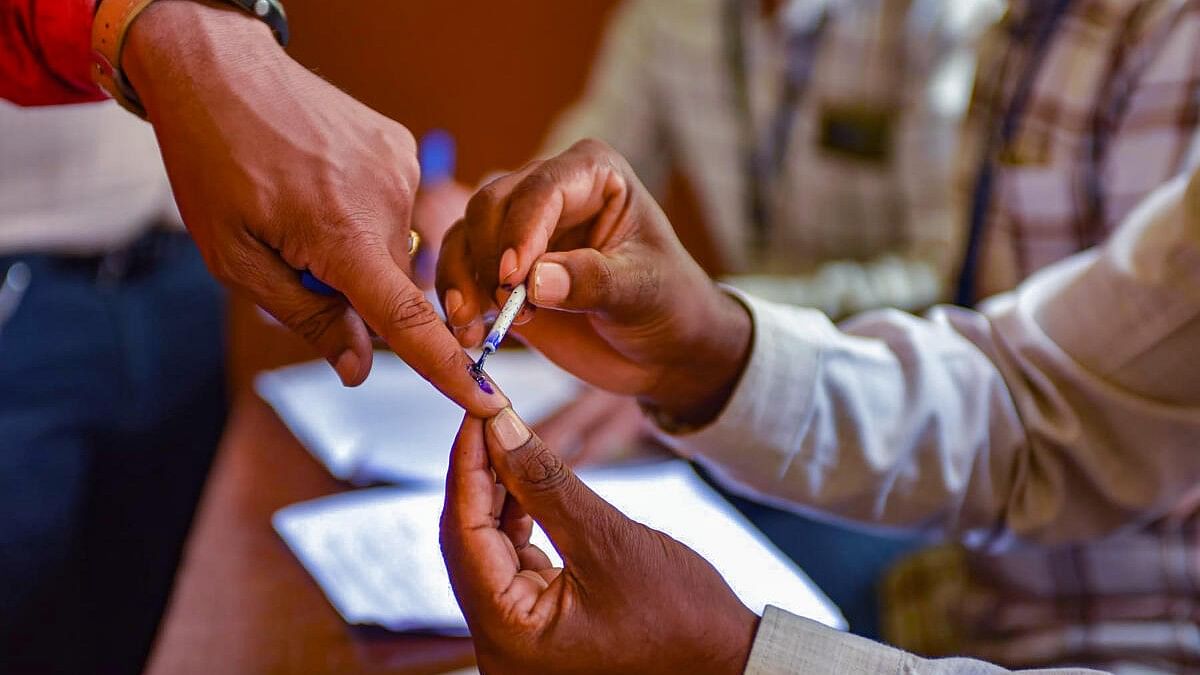 <div class="paragraphs"><p>An employee gets his finger inked before casting his vote for Lok Sabha polls through postal ballots, in Chikmagalur. (Representative image)</p></div>