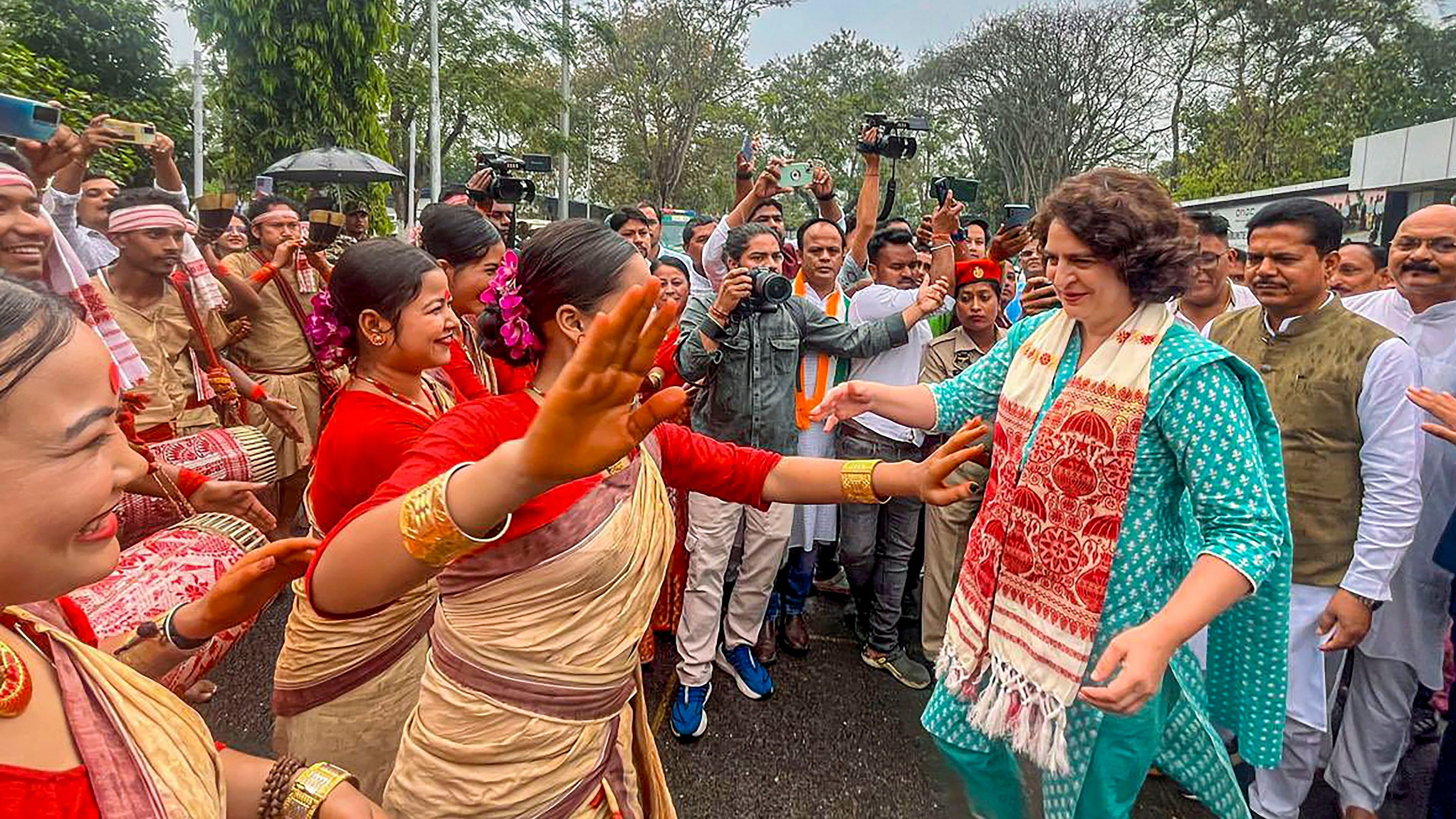 <div class="paragraphs"><p>  Congress leader Priyanka Gandhi Vadra dances with artists during an election campaign rally ahead of Lok Sabha elections, in Jorhat district, Assam, Tuesday, April 16, 2024. </p></div>