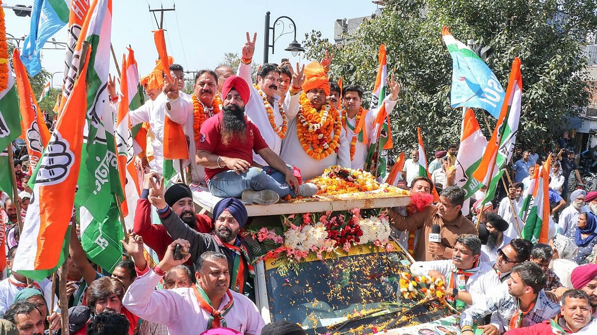 <div class="paragraphs"><p>Congress candidate Raman Bhalla during a rally before filing his nomination for the upcoming Lok Sabha elections, in Jammu, Tuesday, April 2, 2024.</p></div>