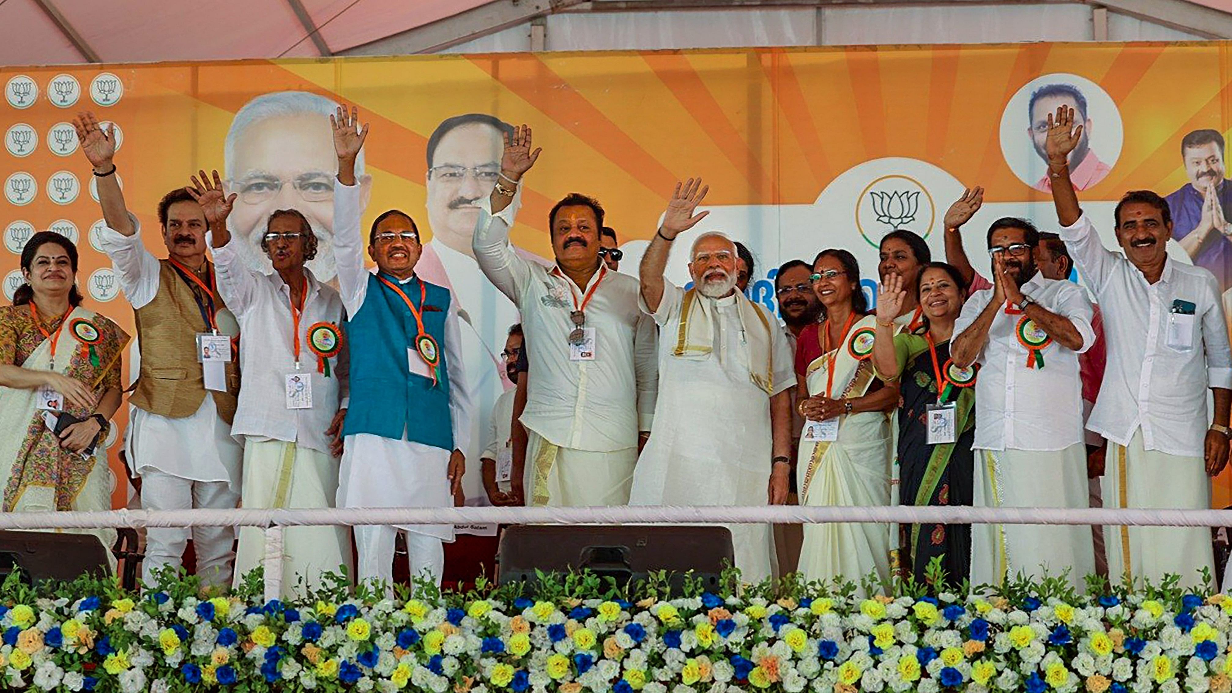 <div class="paragraphs"><p>Prime Minister Narendra Modi and other BJP leaders greet supporters during a public meeting, ahead of Lok Sabha elections, in Alathur, Kerala, Monday, April 15, 2024.</p></div>