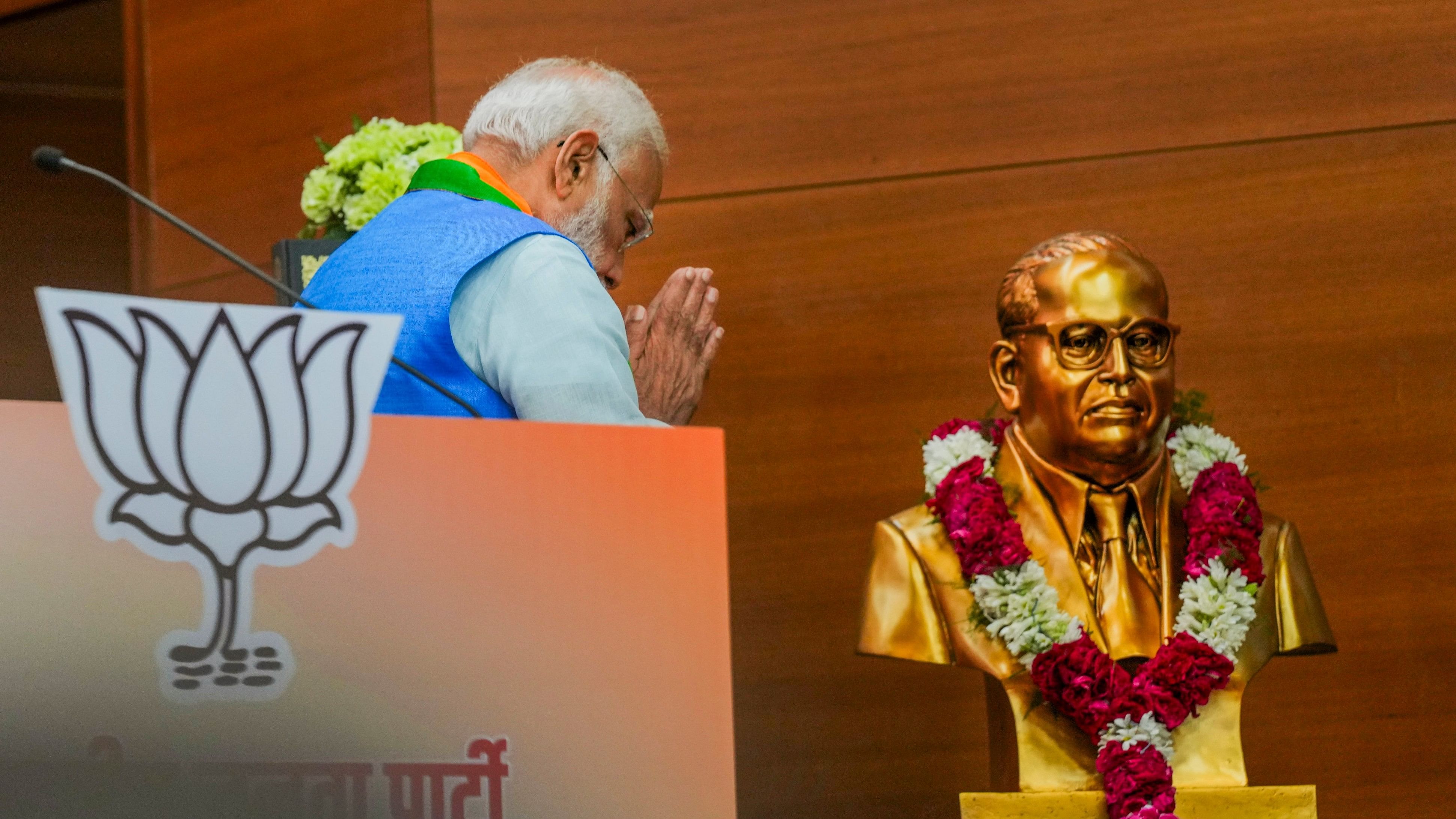 <div class="paragraphs"><p>New Delhi: Prime Minister Narendra Modi pays tribute to BR Ambedkar during the release of the party's election manifesto Sankalp Patra at the party headquarters, in New Delhi, Sunday, April 14, 2024.</p></div>