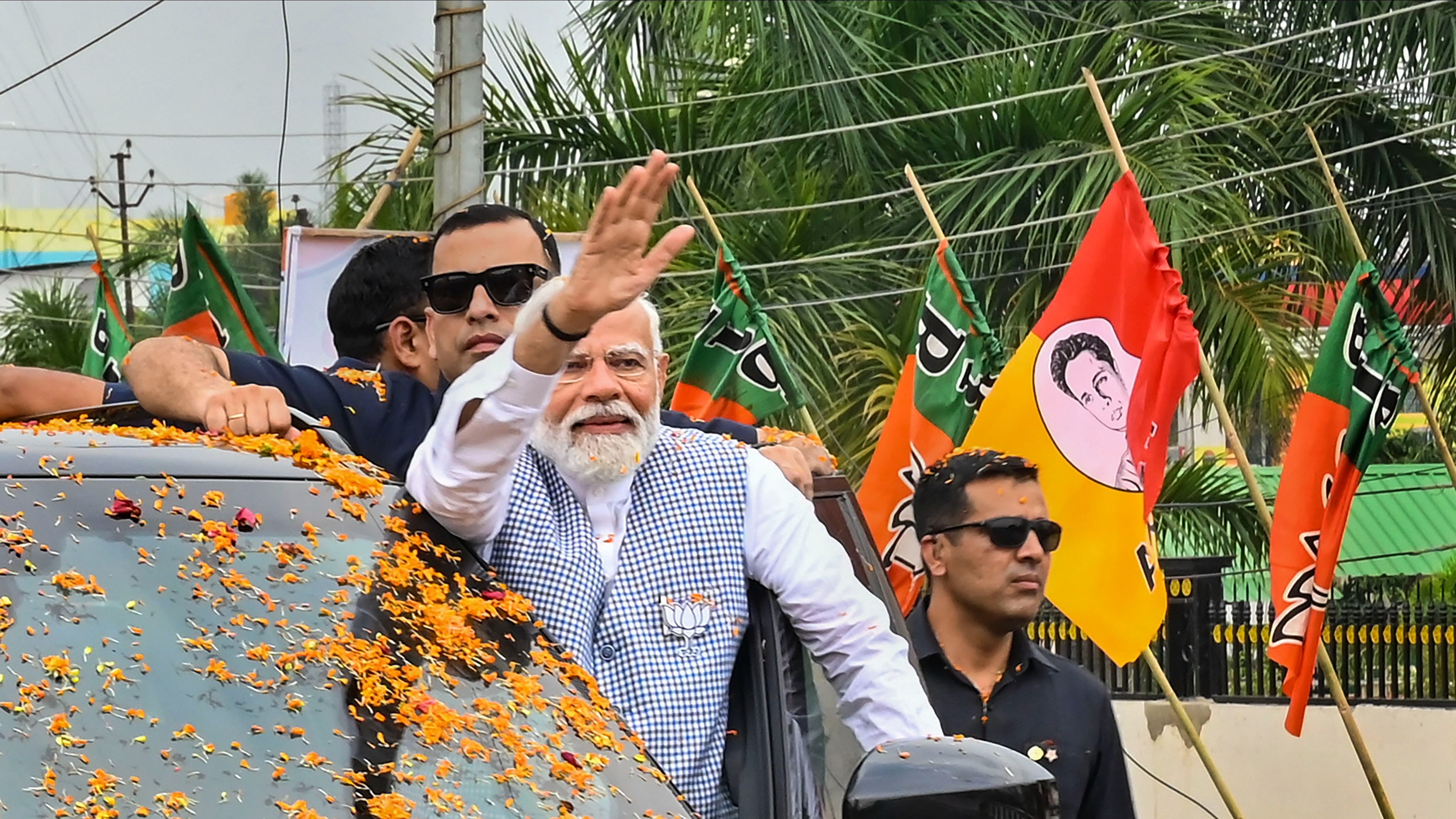 <div class="paragraphs"><p>Prime Minister Narendra Modi waves to supporters upon his arrival for a public meeting in Agartala, on Wednesday, April 17, 2024.</p></div>