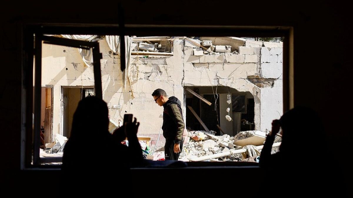 <div class="paragraphs"><p>Palestinians inspect the site of an Israeli strike on a house, amid the ongoing conflict between Israel and the Palestinian Islamist group Hamas, in Rafah, in the southern Gaza Strip.</p></div>