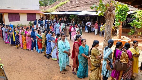 <div class="paragraphs"><p>Voters wait in a queue at a polling station to cast their votes for the second phase of Lok Sabha elections, in Kozhikode.</p></div>