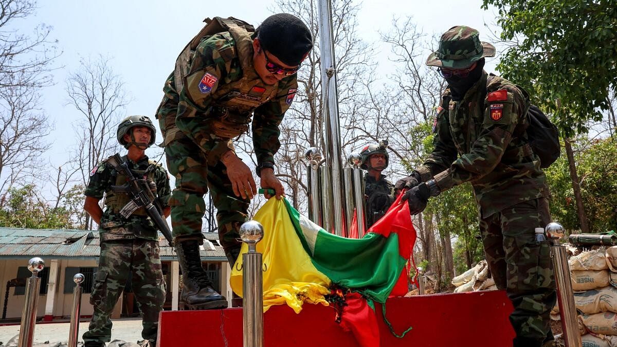 <div class="paragraphs"><p>LT Saw Kaw, a soldier of the Karen National Liberation Army (KNLA) in charge of the Cobra column, burns Myanmar's national flag at a Myanmar military base at Thingyan Nyi Naung village on the outskirts of Myawaddy, the Thailand-Myanmar border town under the control of a coalition of rebel forces led by the Karen National Union, in Myanmar.</p></div>