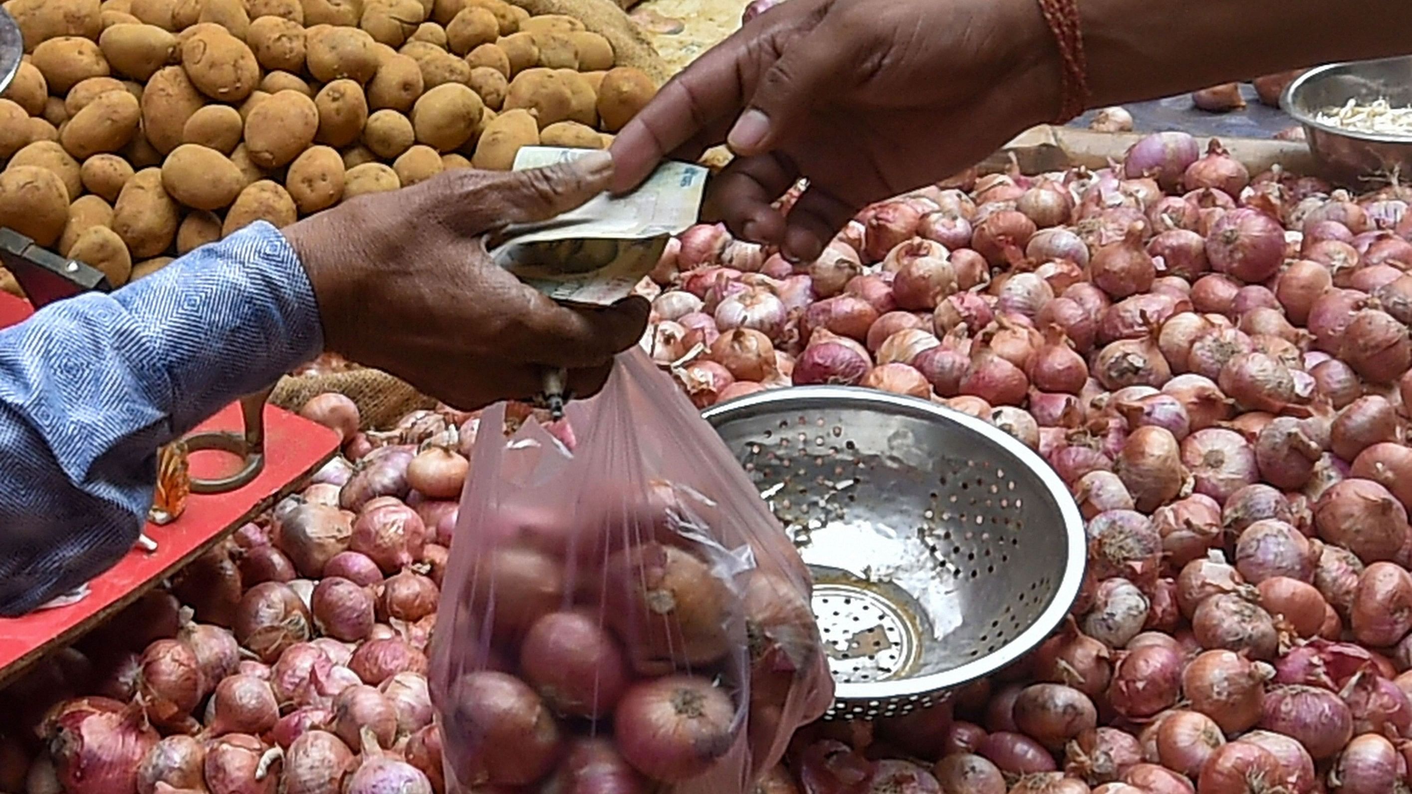 <div class="paragraphs"><p>A customer buys onions at a wholesale market as the vegetable prices continue to soar in the country, in Kolkata, Wednesday, Oct. 28, 2020.</p></div>