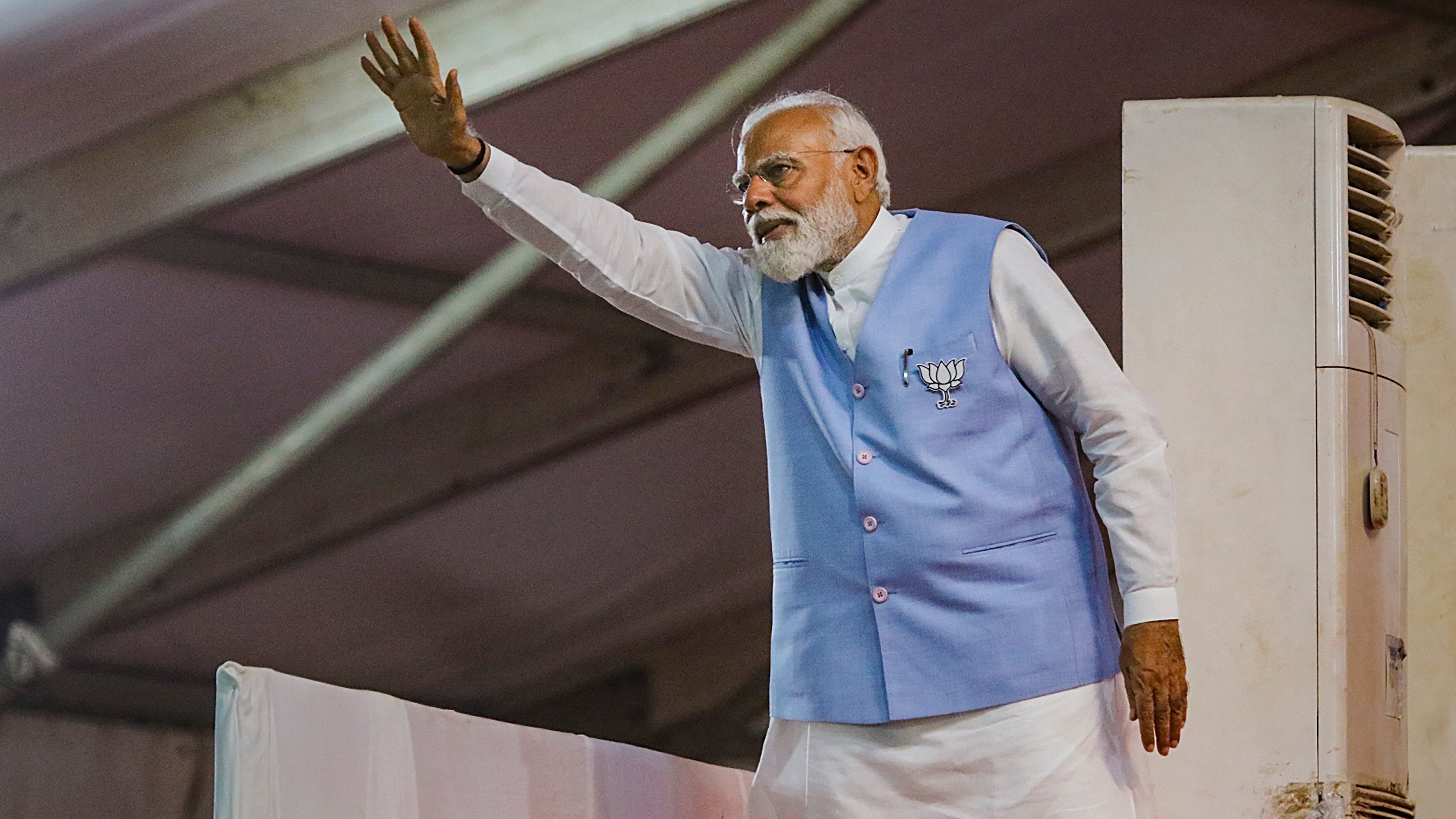 <div class="paragraphs"><p>Prime Minister Narendra Modi waves to the gathering during a public rally ahead of the upcoming Lok Sabha election, in Nagpur, Wednesday, April 10, 2024. </p></div>