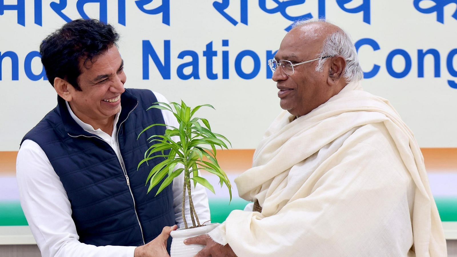 <div class="paragraphs"><p>Devender Yadav and Congress Chief Mallikarjun Kharge.</p></div>