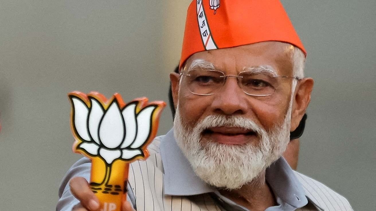 <div class="paragraphs"><p>PM Narendra Modi greets supporters during his roadshow, ahead of the general elections, in Ghaziabad, India, April 6, 2024. </p></div>