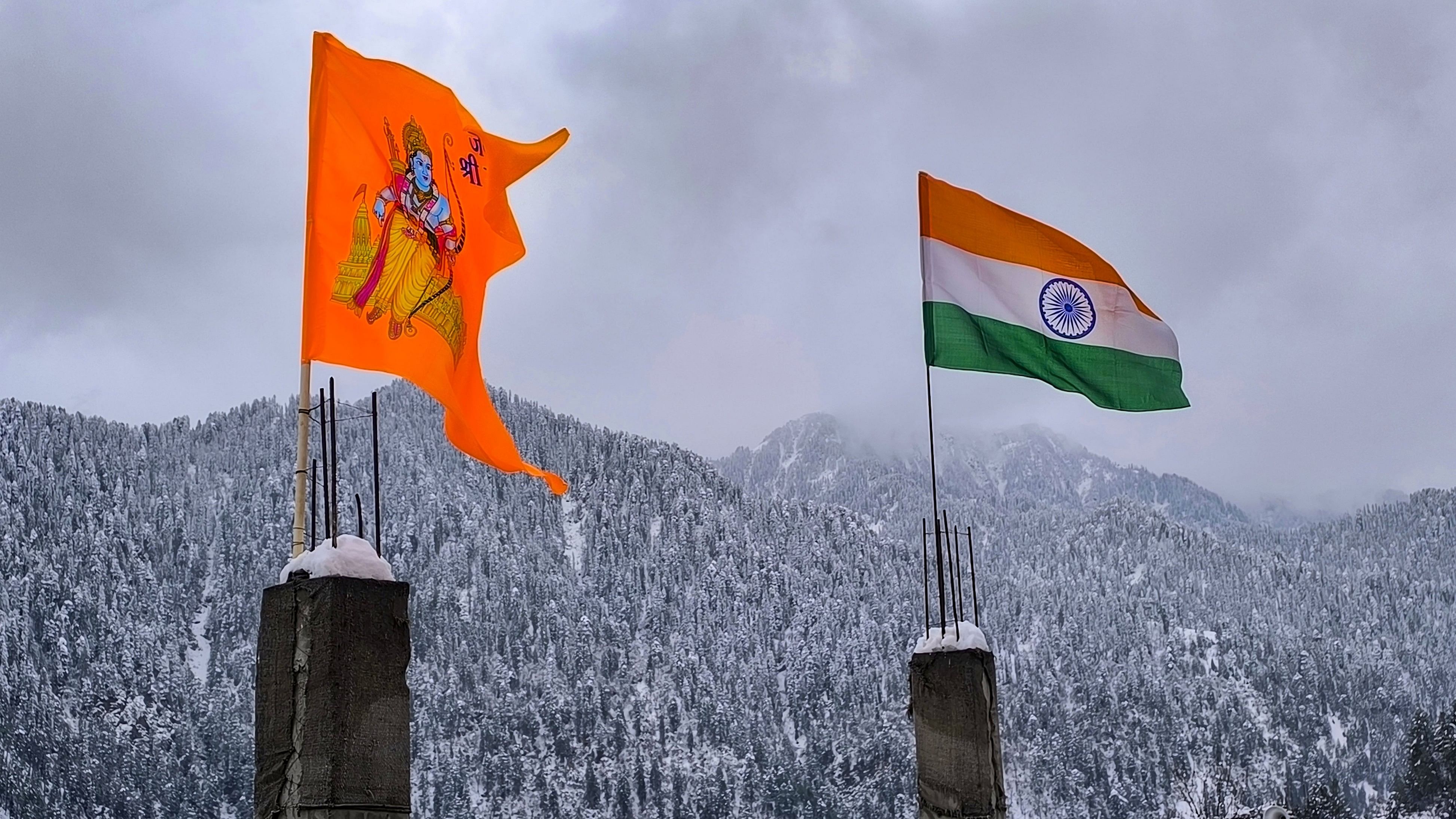 <div class="paragraphs"><p>An Indian flag and a saffron flag  in the backdrop of snow covered ranges in North India.</p></div>