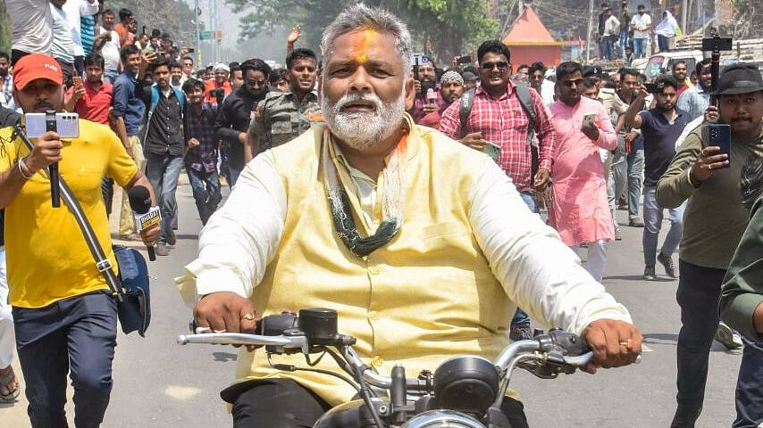 <div class="paragraphs"><p>Congress leader Rajesh Ranjan alias Pappu Yadav rides a bike during a procession before filing nomination as an independent candidate for the upcoming Lok Sabha election, in Purnea.</p></div>
