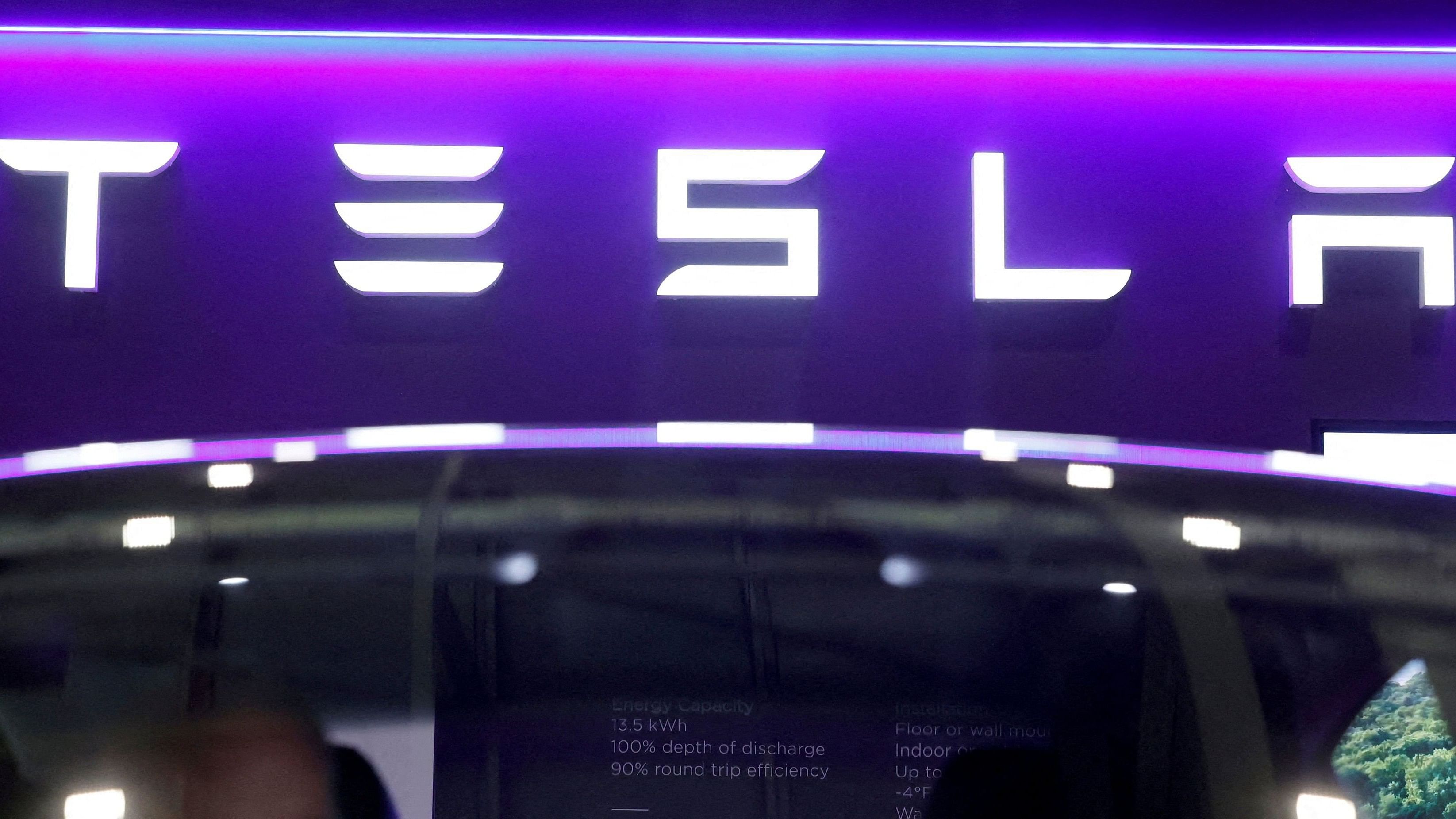 <div class="paragraphs"><p> The logo of Tesla on display at the Everything Electric exhibition at the ExCeL London international exhibition and convention centre in London, Britain.</p></div>