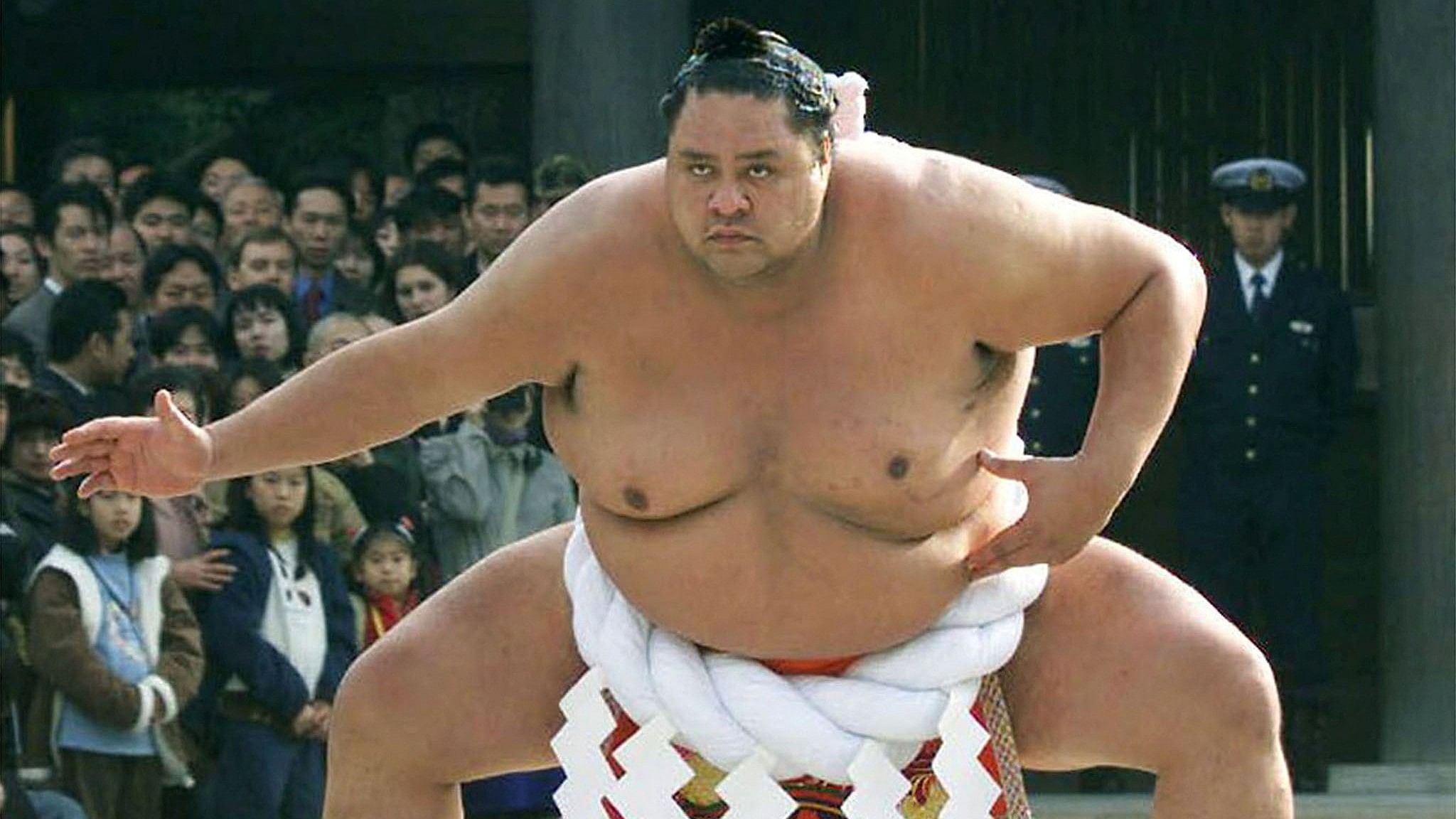 <div class="paragraphs"><p>Hawaiian-born sumo wrestler Akebono, Japan's first foreign-born yokozuna or sumo grand champion, seen performing a sacred ring-entering ritual at Tokyo's Meiji Shrine.</p></div>