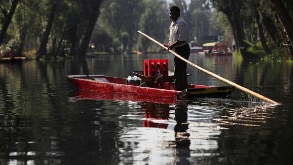 <div class="paragraphs"><p>A man sails on the water canal in Xochimilco, where the only reminder of traditional Pre-Hispanic land-use in the lagoons of the Mexico City basin is practiced, ahead of Earth Day.</p></div>