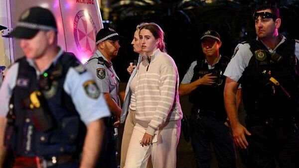 <div class="paragraphs"><p>Members of the public are escorted by NSW police officers from inside Westfield Bondi Junction after multiple people were stabbed inside the eastern suburbs shopping centre in Sydney, Australia April 13, 2024.</p></div>
