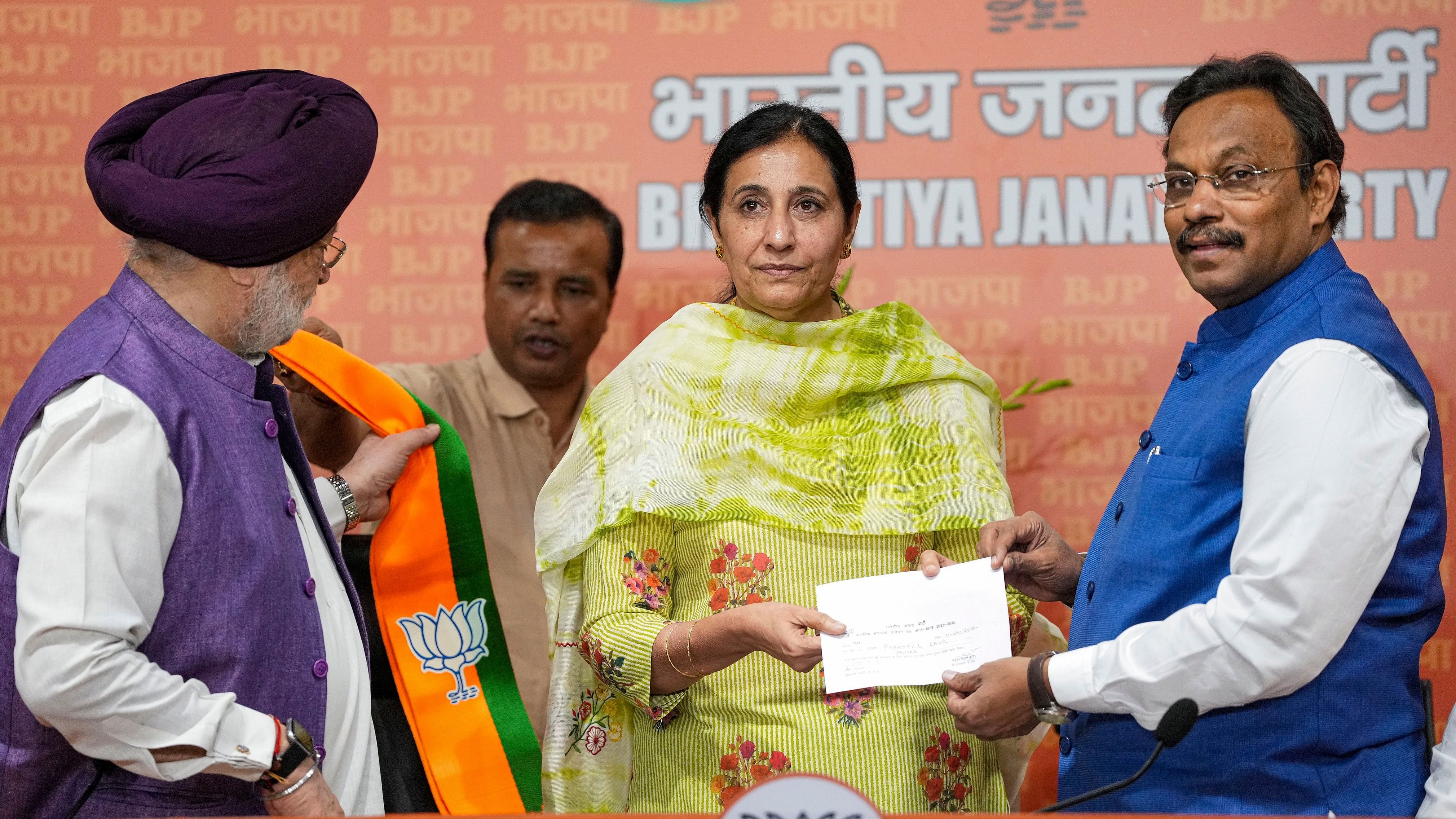 <div class="paragraphs"><p>New Delhi: Union Minister and BJP leader Hardeep Singh Puri and BJP National General Secretary Vinod Tawde welcome IAS Parampal Kaur as she joins BJP, in New Delhi, Thursday, April 11, 2024. </p></div>