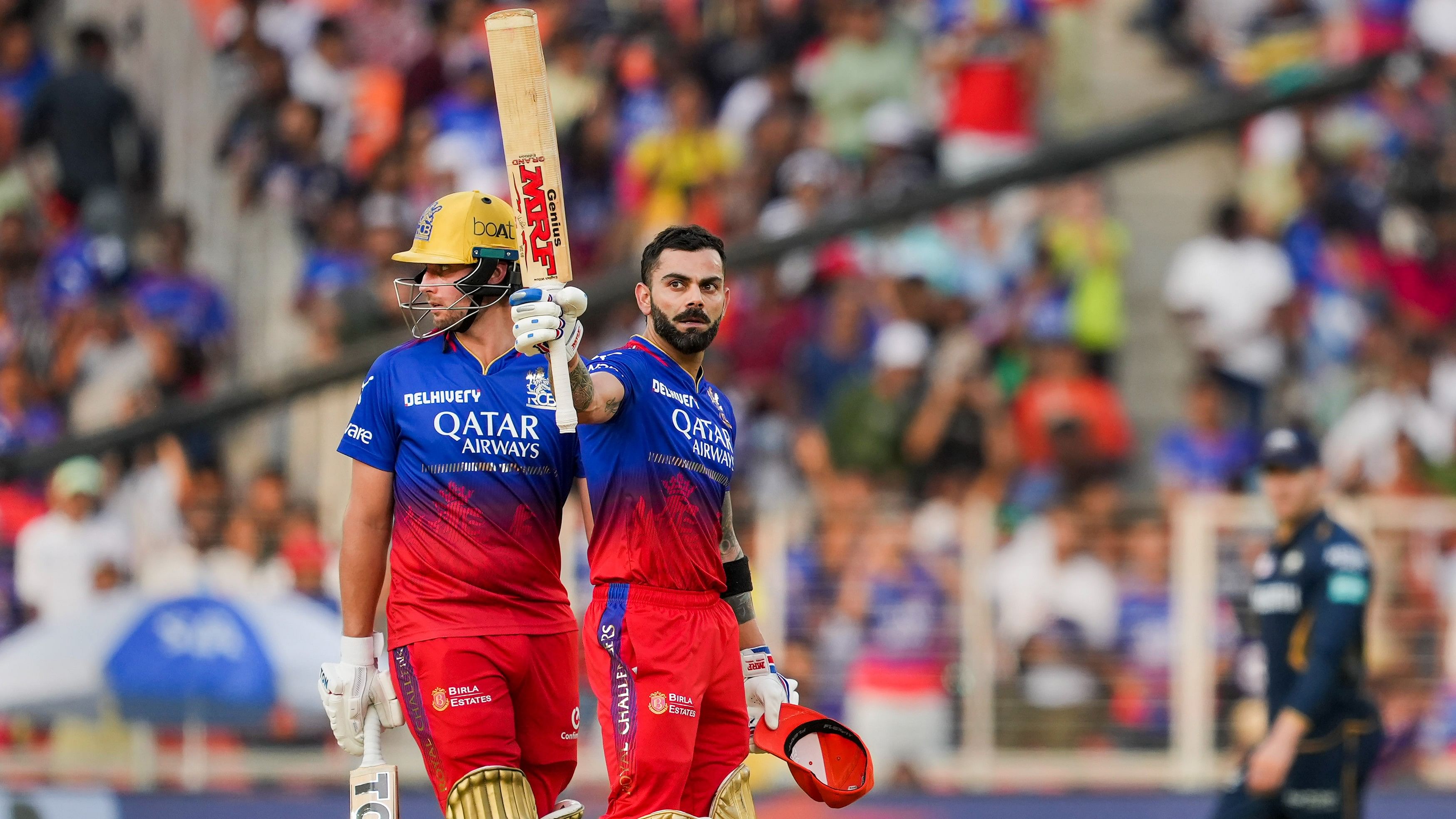 <div class="paragraphs"><p>Royal Challengers Bengaluru's Virat Kohli celebrates his half century with Will Jacks agisnt Gujarat Titans at the Narendra Modi Stadium, in Ahmedabad, on Sunday</p></div>