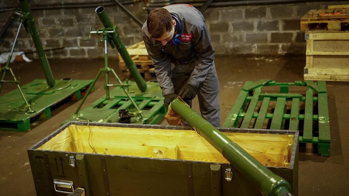 <div class="paragraphs"><p>Employee prepares to place a mortar into a box at a production facility of the 'Ukrainian Armor' company in Ukraine.</p></div>