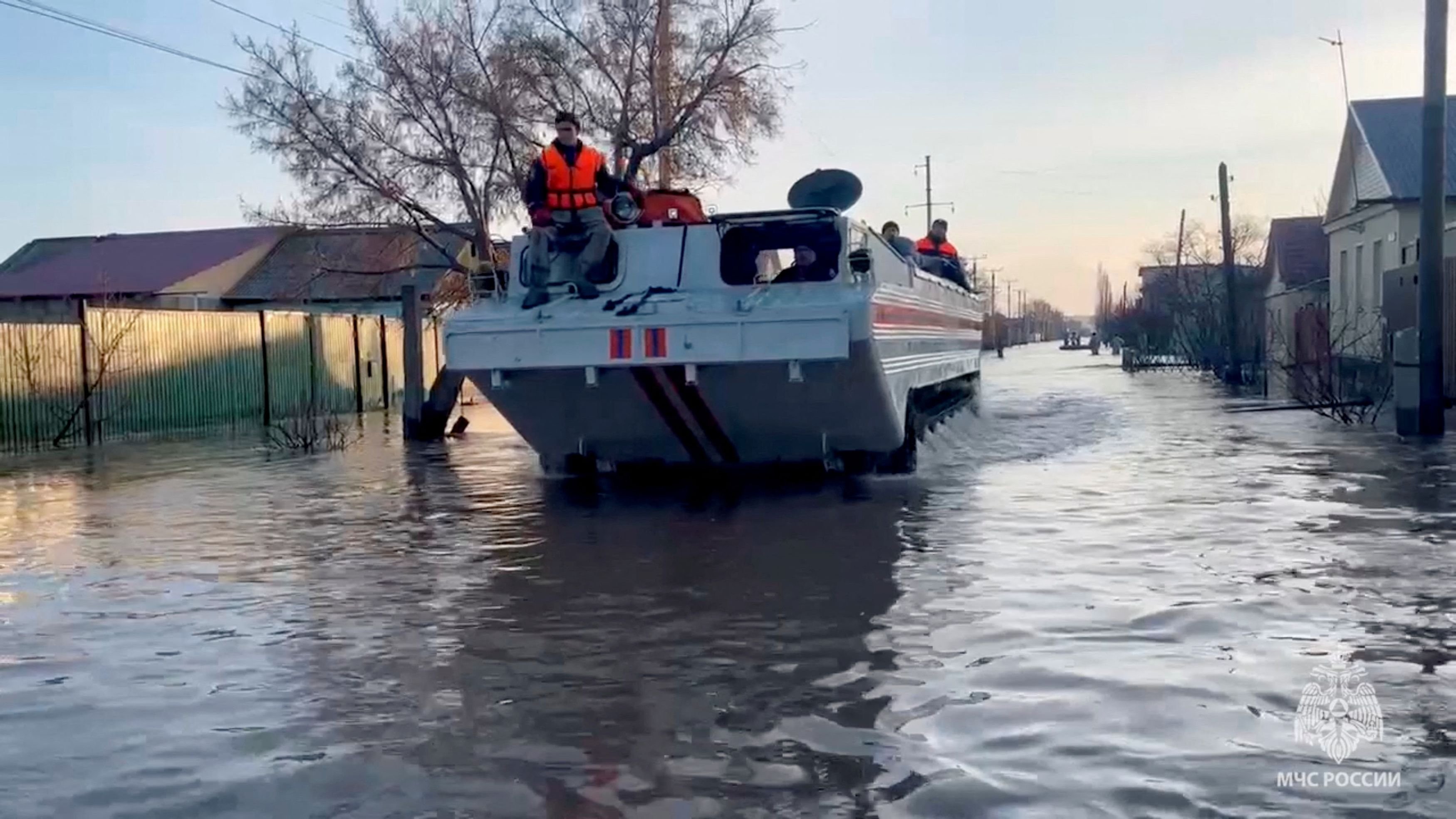 <div class="paragraphs"><p>Rescuers search for residents to evacuate as they drive in a flooded residential area in Russia. </p></div>