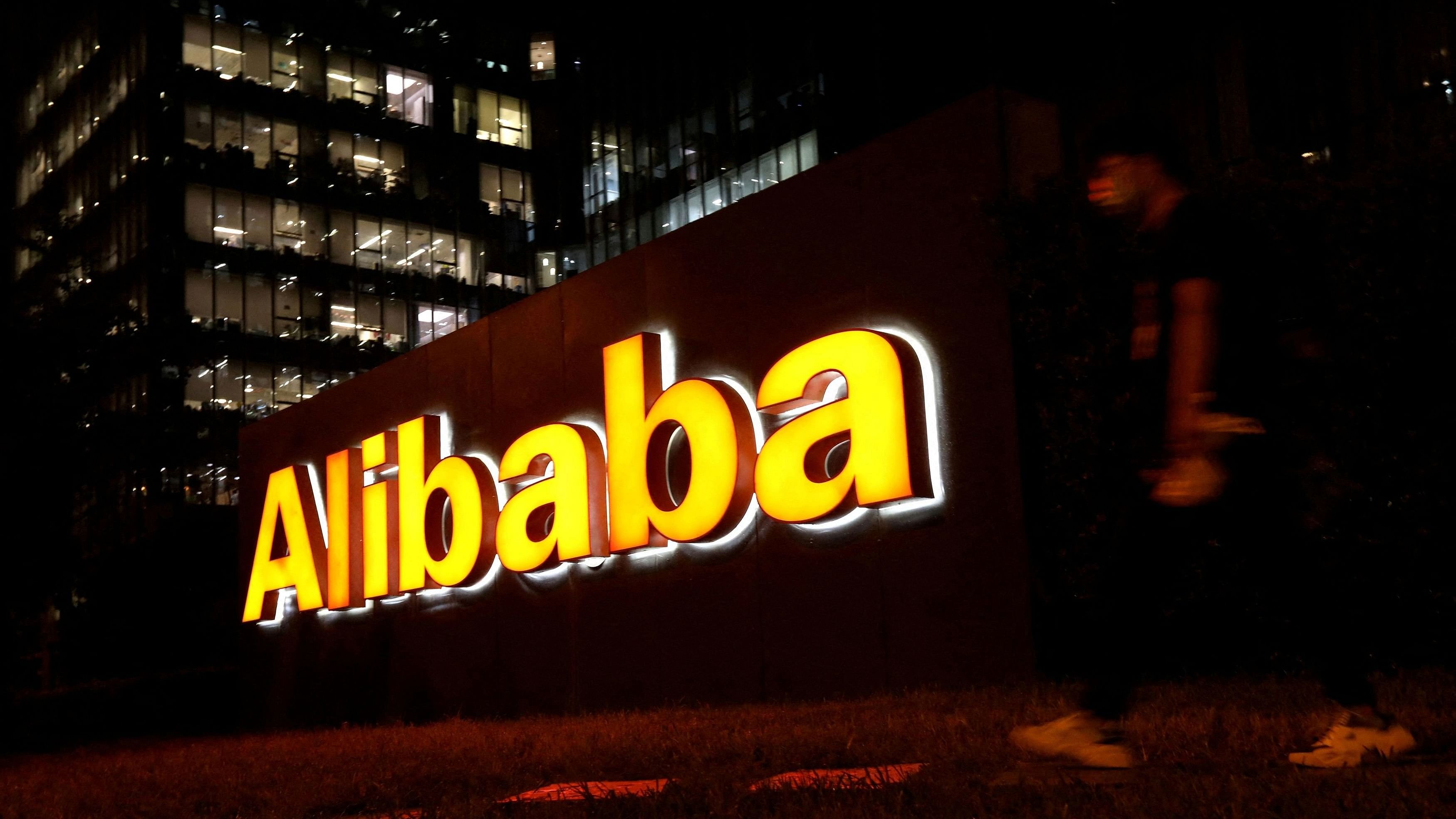 <div class="paragraphs"><p>A man walks past Alibaba Group's logo at its office building in Beijing, China.&nbsp;</p></div>