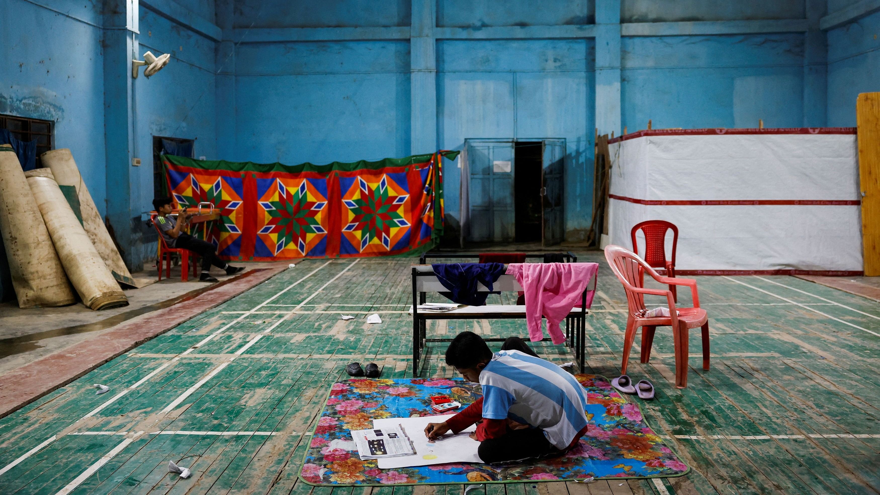 <div class="paragraphs"><p>A boy does his homework inside a Meitei relief camp for displaced people in Imphal, Manipur.&nbsp;</p></div>