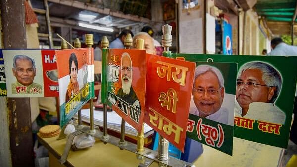 <div class="paragraphs"><p>Merchandise of different political parties are displayed for sale at a shop ahead of the upcoming Lok Sabha election.</p></div>