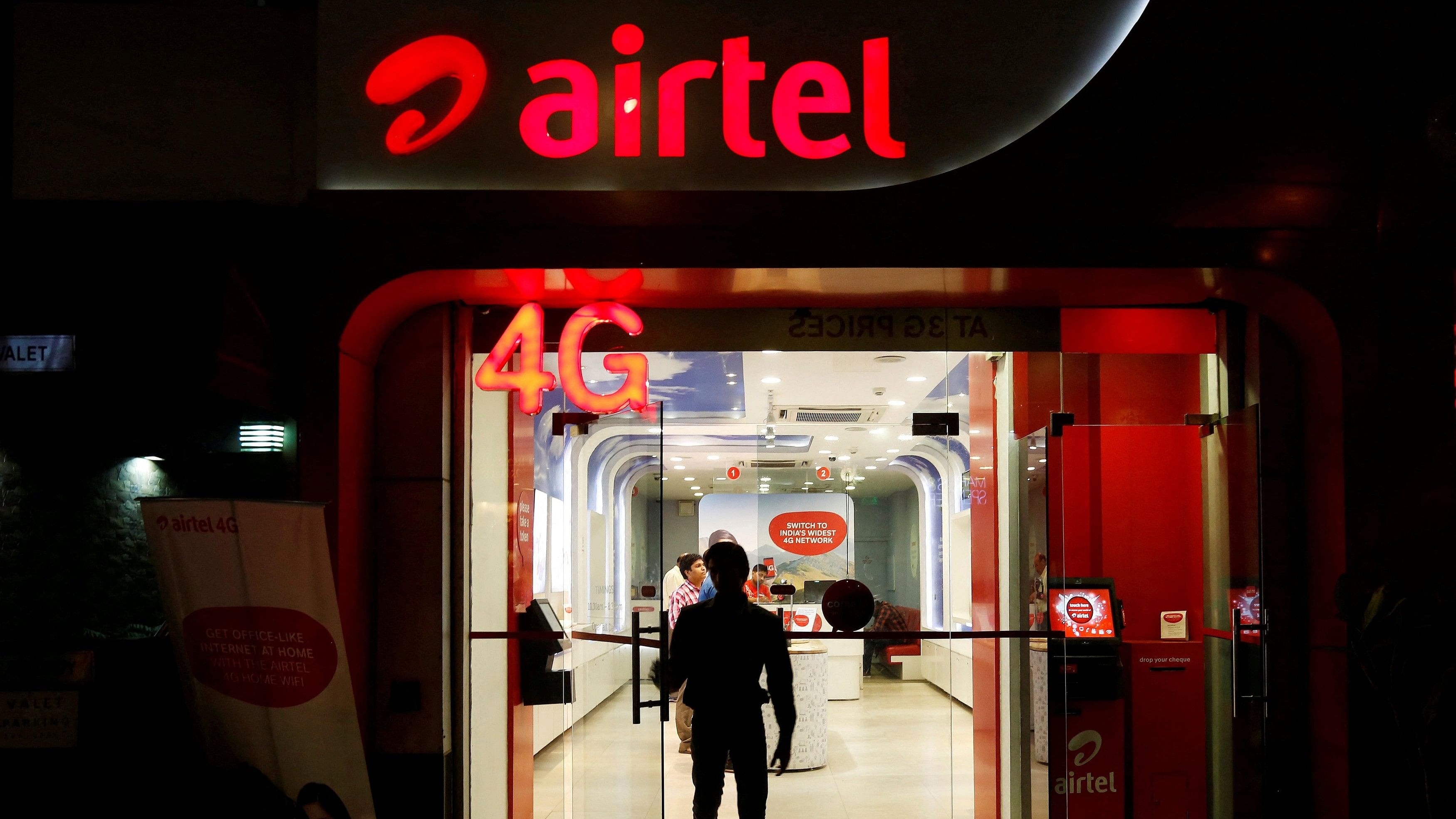 <div class="paragraphs"><p>File photo shows a man leaving a Bharti Airtel store in New Delhi, India.</p></div>