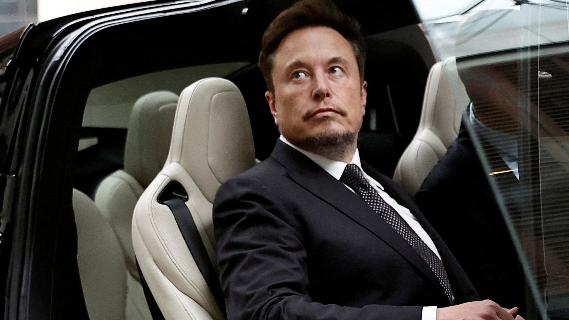 <div class="paragraphs"><p>Tesla Chief Executive Officer Elon Musk gets in a Tesla car.</p></div>