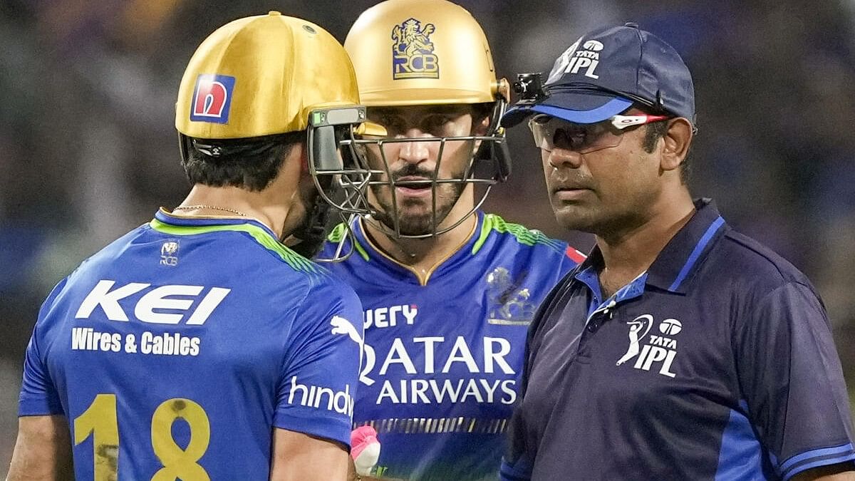<div class="paragraphs"><p>RCB's Virat Kohli with captain Faf du Plessis interacts with the umpires after he was caught and bowled by KKKR's Harshit Rana during an IPL cricket match on Sunday.&nbsp;</p></div>