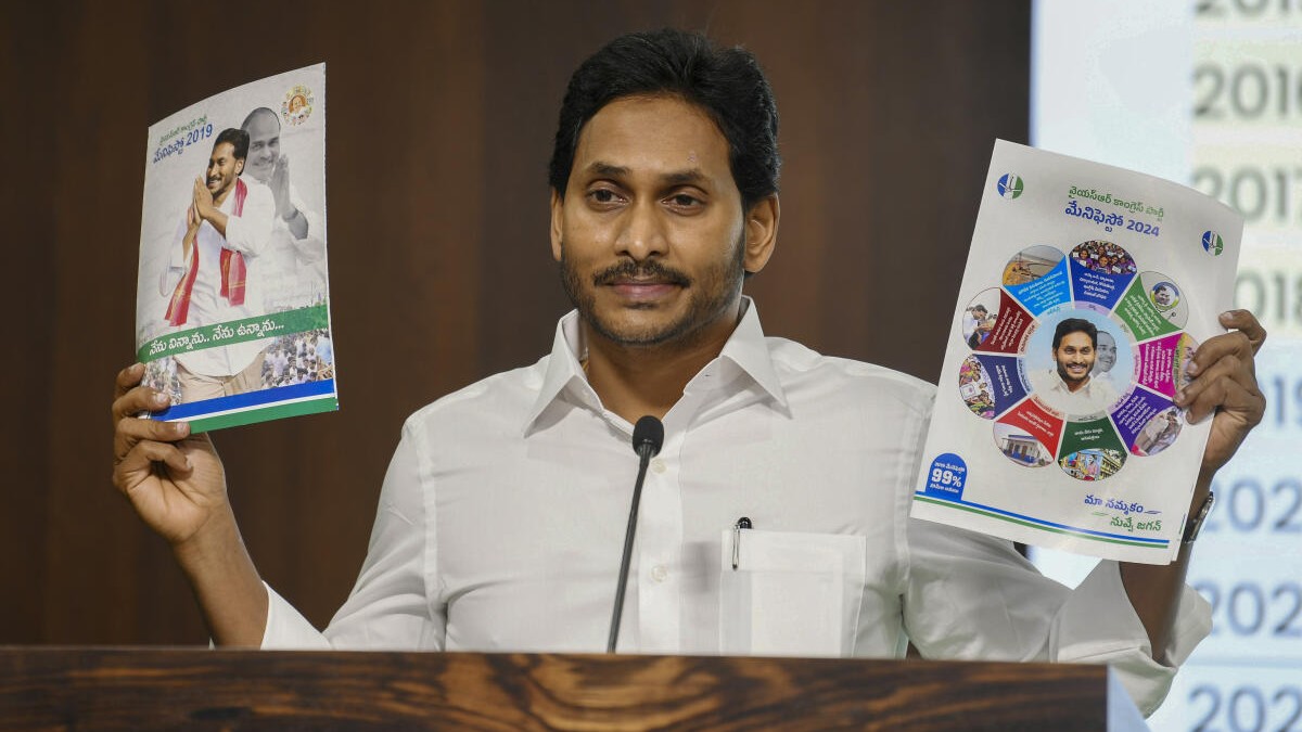 <div class="paragraphs"><p>YSRCP chief YS Jagan Mohan Reddy with the party manifesto.</p></div>