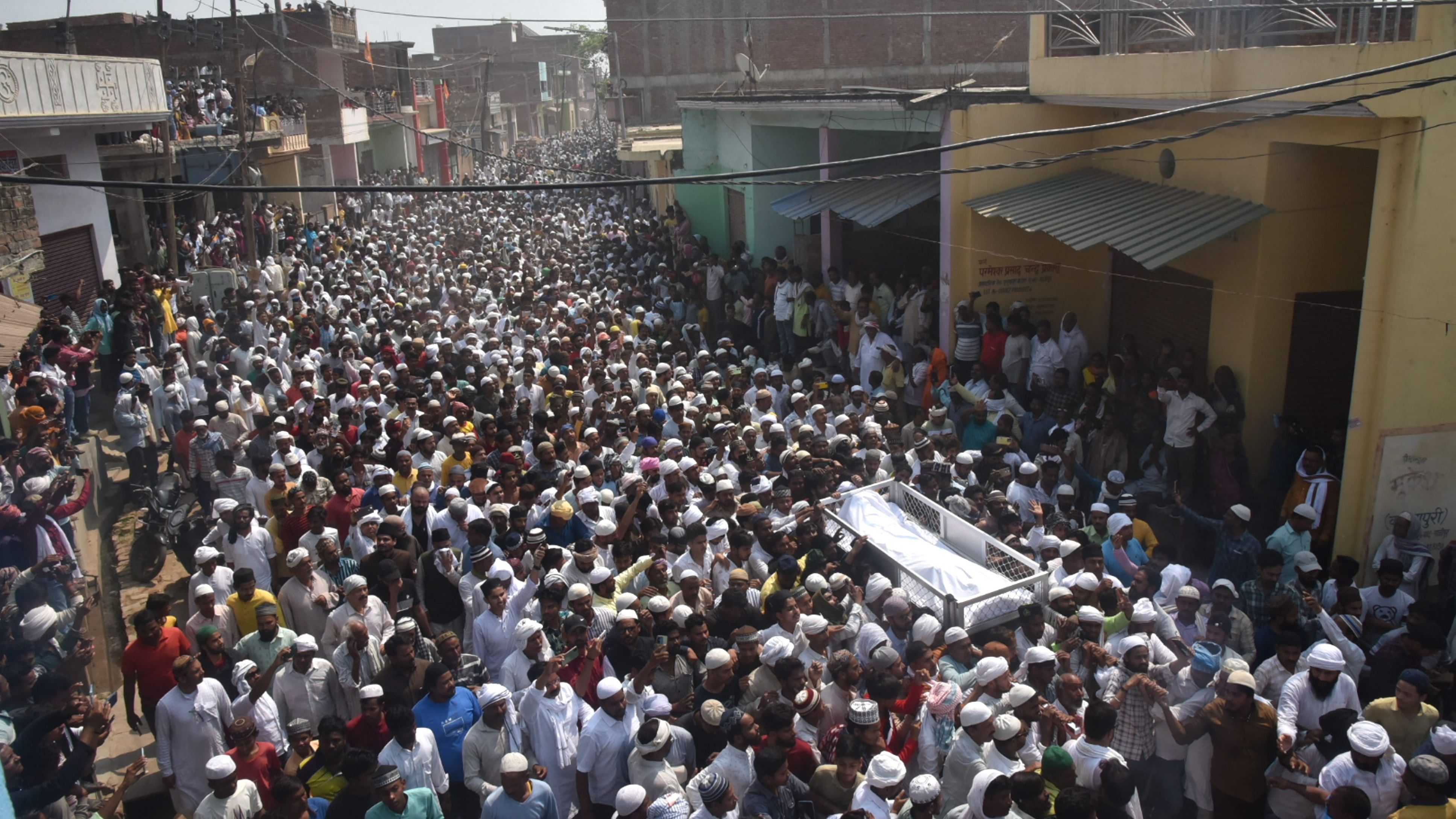 <div class="paragraphs"><p>A crowd gathers at the residence of the gangster-turned-politician Mukhtar Ansari during his funeral at Mohammadabad, in Ghazipur district, Saturday, March 30, 2024.</p></div>