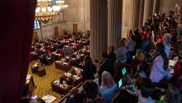 <div class="paragraphs"><p>Gun reform activists protest in the House gallery at the Tennessee State Capitol building as the House votes to adopt Senate bill 1325 that would authorize teachers, principals, and school personnel to carry a concealed handgun on school grounds, in Nashville, Tennessee, US, April 23, 2024</p></div>