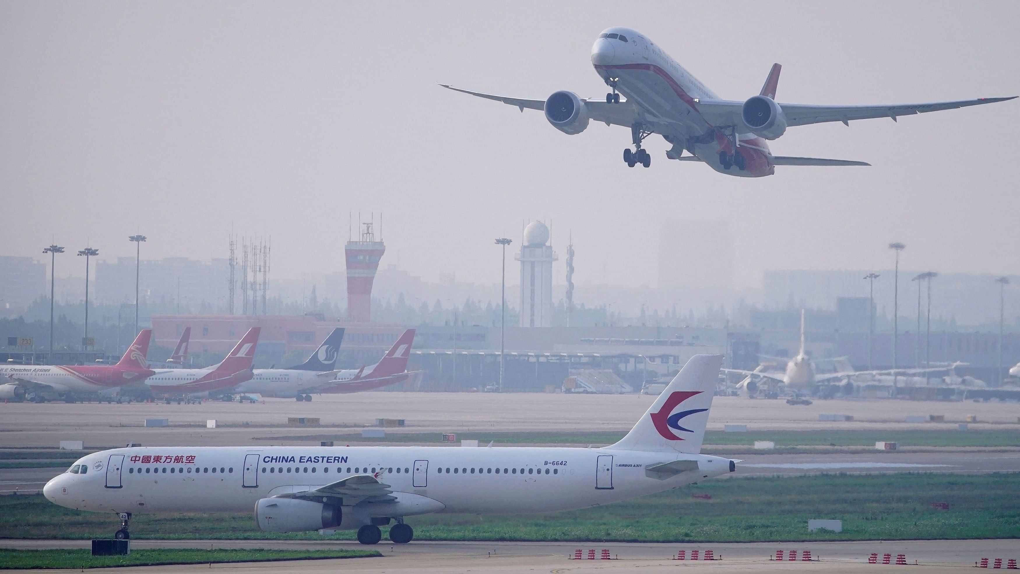 <div class="paragraphs"><p>FILE PHOTO: A China Eastern Airlines aircraft and  Shanghai Airlines aircraft are seen in Hongqiao International Airport in Shanghai, following the coronavirus disease  outbreak, China.</p></div>