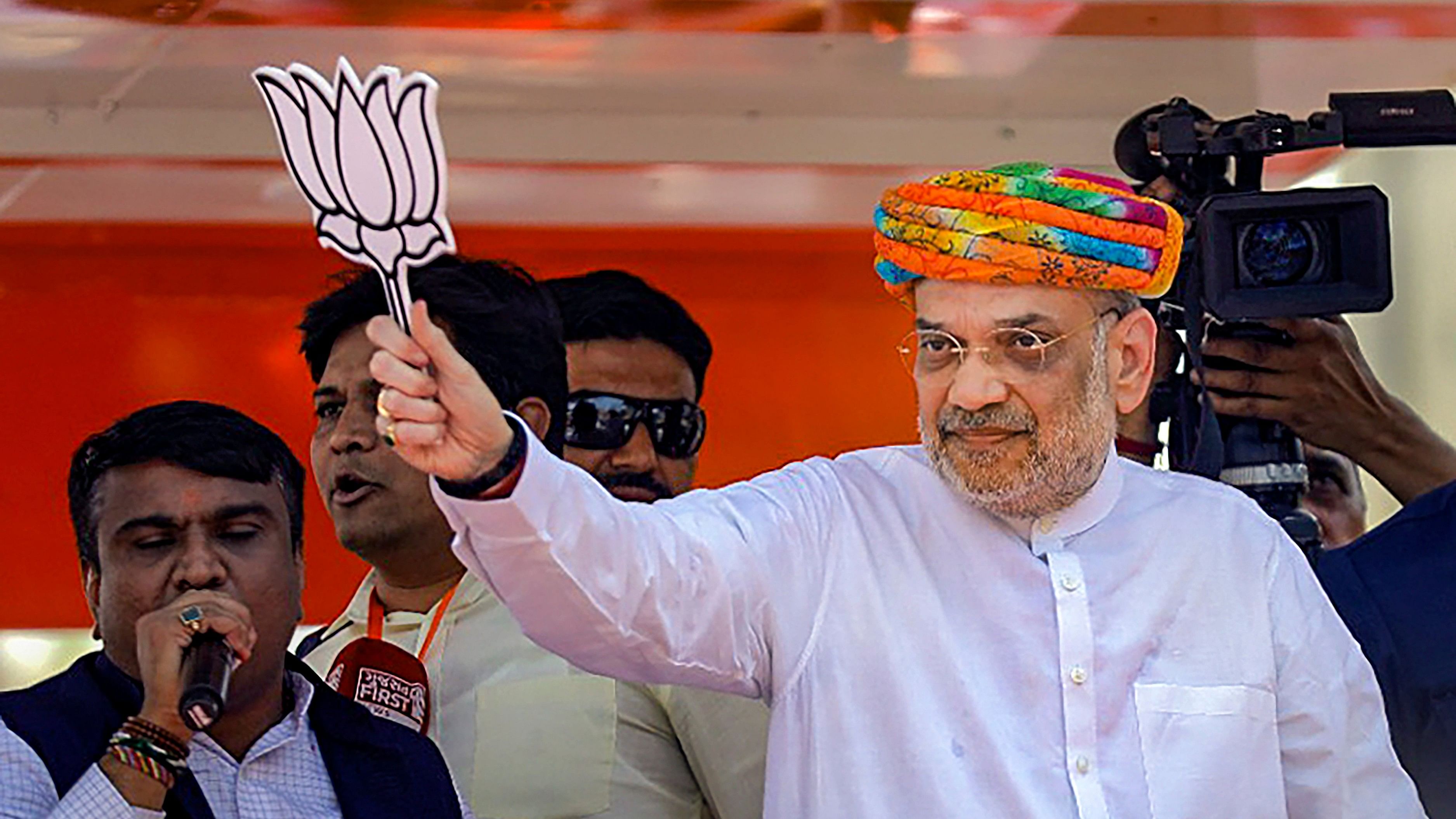 <div class="paragraphs"><p> Union Home Minister and BJP Gandhinagar candidate Amit Shah during a roadshow ahead of Lok Sabha elections, in Sanand, Gujarat, Thursday, April 18, 2024.</p></div>