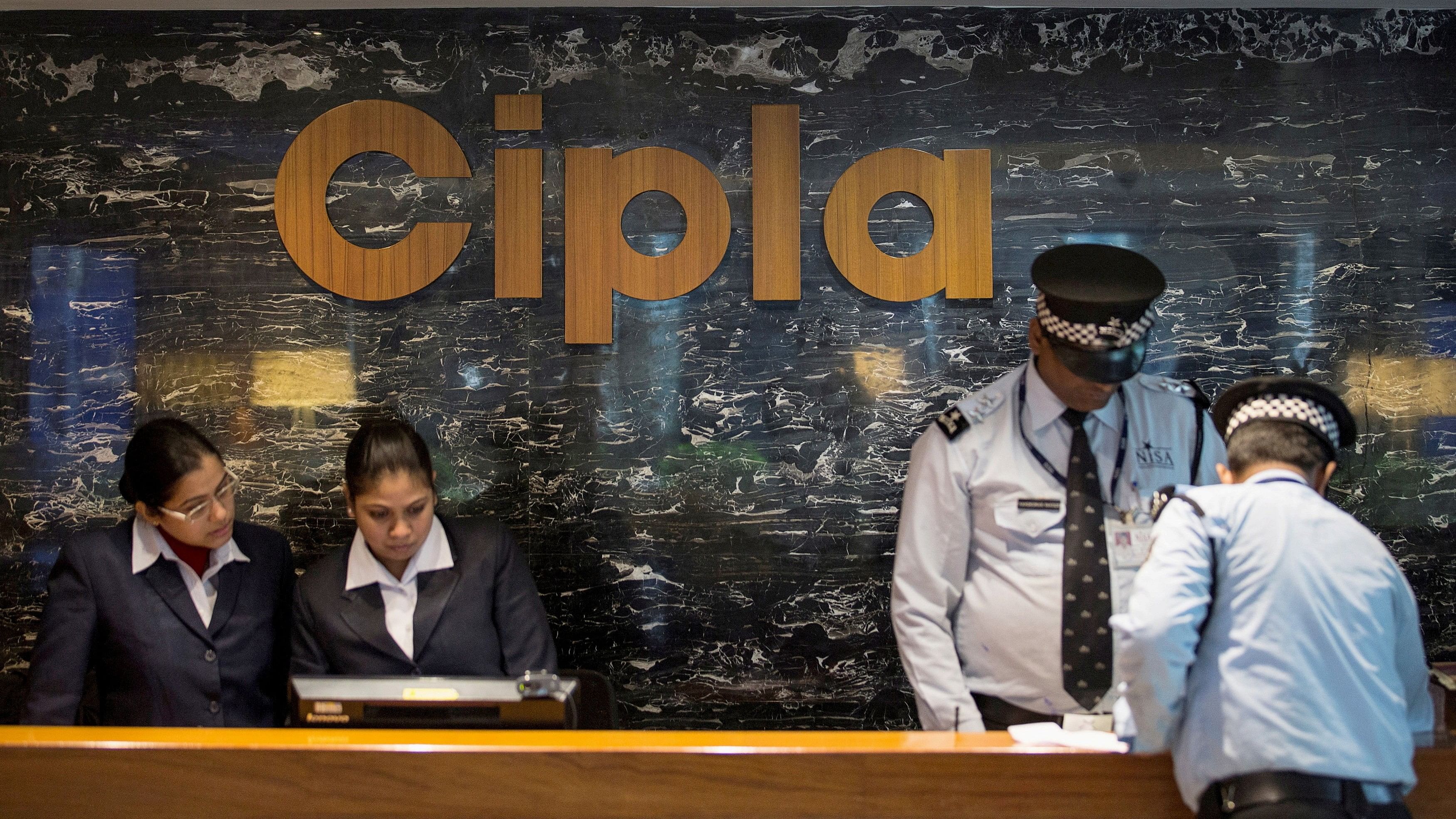 <div class="paragraphs"><p>Employees and security staff work at the reception area of Cipla.</p></div>